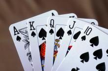 hand of 5 playing cards, royal flush in spades